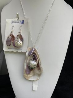 "Natural sea shell pendant necklace, ocean shells clustered with all different types of shells finished with a Sterling plated Sea shell locket pendant with matching earrings with Sterling plated shells also. Includes Sterling plated earring hoops.  On a Sterling silver plated 20\" cable chain. Unique seashell pendant measures 3 1/4\" X 1 3/4'' Earrings are 2 1/8 from the lob part of the hook.  You can compare the size of the shells to the $0.50 cent piece in the pictures. All my necklaces are d Unique Shell Jewelry Gift, Unique Shell Jewelry For Gifts, Unique Shell-shaped Mother Of Pearl Jewelry, Ocean-inspired Shell-shaped Mother Of Pearl Jewelry, Unique Mother Of Pearl Shell Jewelry, Shell-shaped Jewelry With Pearl Pendant, Shell-shaped Pearl Pendant Jewelry, Ocean-inspired Shell-shaped Pearl Pendant Jewelry, Shell-shaped Mother Of Pearl For Jewelry Making