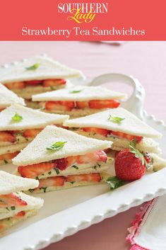 strawberry tea sandwiches on a white platter with strawberries in the background and text overlay that reads southern new strawberry tea sandwiches