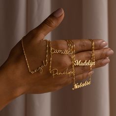 "S I N G A P O R E ∙ C H A I N ∙ N A M E ∙ N E C K L A C E Customize this nameplate necklace to anything your heart desires. Personalized to a name or word of your choosing- this is the perfect gift for a Bridesmaid Proposal, to memorialize an inside joke between friends, or help to keep someone special close. * Material: High Quality Solid 925 Sterling Silver * Finish: Sterling Silver ∙ 18K Gold ∙ Rose Gold * Dimensions: Depending on your font choice, height sizes range from 3mm to 4mm lowercas Jewelry Stack, Necklace Stack, Necklace Chain Types, Top Diy, Gold Water, Nameplate Necklace, Gold Name Necklace, Group Boards, Rose Gold Chain