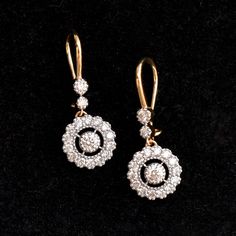 A stunning diamond dangle earrings are a perfect pair for your big day! With over a quarter carat of diamonds, these earrings sport a 0.10ct diamond in the center with a scalloped diamond halo which dangles beautifully from 2 diamonds! The ear wire is comfortable and can be locked for a secure fit! * Diamond Wt. : 0.85 Cts * Color-Clarity Grade : H-I, Vs-Si * Gold - 14K, 3 gms solid gold These earrings come in a lovely gift box with EGL certification. Find us on Instagram for exquisite designs: Timeless Diamond Cut Diamond Earrings For Wedding, Timeless Diamond Cut Earrings For Wedding, Formal Dazzling Diamond Earrings With Single Cut Diamonds, Luxury Drop Earrings With Single Cut Diamonds, Luxury Single Cut Diamond Drop Earrings, Diamond Drop Earrings For Wedding, Fine Jewelry Bridal Drop Earrings With Brilliant Cut, Timeless Diamond Drop Earrings For Wedding, Exquisite Diamond White Drop Earrings