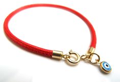 "Kabbalah good luck bracelet 14k gold red string Luxurious bracelet 14k solid Gold beautiful solid yellow 14 k gold and Italian leather bracelet delicate bracelet See description below: * Italian red embroidered leather cord 2.5mm * 14k solid gold and enamel evil eye charm - 6mm - 0.025gr * 14 k solid Gold end caps * 14 solid Gold spring closure *By Symbolina Evil eye: Is a sign of protection that also represents blessings, power, and strength, and is seen as potent in deflecting the evil eye. F Yellow Gold Round Jewelry For Blessing, Elegant Jewelry With Adjustable Cord And Round Beads, Luxury Adjustable Cord Jewelry As Gift, Adjustable Jewelry With Round Beads For Good Luck, Single Strand Bracelet Jewelry Gift, Luxury Adjustable Bracelets With Charms, Single Strand Bracelet As Gift, Luxury Adjustable Charms Bracelets, Adjustable Bracelet With Gold Clasp For Gifts