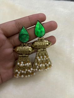 Beautiful Premium Quality Emerald Earrings *For More Beautiful Collection, Check At https://www.etsy.com/shop/placeoffashion *Necklace Fitting Is Adjustable *Earring Closure: Push Back **Necklace Closure : Beautiful Silk Thread *It is a Bridal or Partywear Set. *It Will Give You a Unique and Beautiful Look  *You Can Wear This Beautiful Set At Dress or Saaree  *The Colour Combination Of This Set Is Very Unique , It can go With Any Of The Outfit *It Gives You a Unique Look For Your Special Events Traditional Green Beaded Earrings For Party, Traditional Green Beaded Party Earrings, Unique Beaded Earrings For Festive Occasions, Unique Festive Beaded Earrings, Green Bridal Earrings With Latkans For Celebration, Green Fusion Style Earrings For Celebration, Green Fusion Earrings For Celebration, Green Latkans Danglers For Celebration, Green Danglers With Latkans