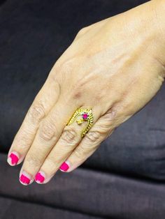 traditional 22 karat gold vanki ring with red stone
  most vanki rings are self adjustable in size.    - 235-GVR315 - in 2.600 Grams for USD $336.46 USD. 
Made in India by Totaram Jewelers Online this product is in Gold - 22 Karat BIS Hallmark 916 Gold  & is an excellent gift for Adult - Women. Ships fully insured with secured guaranteed delivery for free with your order over $250 from New Jersey USA & comes with 30 days exchange policy. Gold Ruby Ring For Marriage In Fine Jewelry Style, Fine Jewelry Gold Ruby Ring For Marriage, Gold Ruby Ring For Marriage, Fine Gold Ruby Ring For Marriage, Traditional Hand Set Rings For Marriage, Yellow Gold Ruby Rings For Marriage, Toe Rings For Anniversary And Festivals, 22k Gold Jewelry For Puja, 22k Yellow Gold Ruby Ring For Anniversary