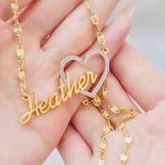 Show your love and appreciation with this stunning custom heart name pendant. This pendant features a two tone design of 10k vermeil gold and sterling silver, creating a beautiful contrast and a unique look. The pendant is shaped like a heart, with a cut-out of your chosen name in the center. The name is also plated with 10k vermeil gold, adding a touch of elegance and sparkle. The pendant comes with a 10k gold 18 inch matching chain, making it ready to wear or gift. This pendant is a perfect wa Custom Heart Necklace With Name For Valentine's Day, Custom Gold Necklace With Name On Heart Pendant, Custom Gold Necklace With Name For Valentine's Day, Custom Gold Name Necklace For Valentine's Day, Yellow Gold Custom Name Heart Pendant Jewelry, Gold Heart-shaped Name Jewelry, Custom Name Yellow Gold Heart Pendant Jewelry, Heart-shaped Gold Jewelry With Names, Custom Name Yellow Gold Heart Pendant