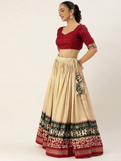 Step out in style this festive season with our fabulous off-white and maroon navratri lehenga choli! Designed with the perfect blend of traditional and modern elements, this ensemble is sure to make you the center of attention at any celebration.
The lehenga features an off-white color, crafted from lustrous tussar silk. With its sweeping 3.40-meter flair, expertly stitched with canvas and an attached cancan, this lehenga is designed to give you a graceful and elegant look. The inner lining of t Off White Sharara For Navratri, Festive Floor-length Cream Choli, Beige Anarkali Set For Navratri, Off White Sets For Navratri With Traditional Drape, Beige Anarkali Set For Navratri Festive, Off White Floor-length Traditional Wear For Navratri, Off White Navratri Sets With Traditional Drape, Festive Anarkali Beige Choli, Cream Traditional Drape Set For Navratri