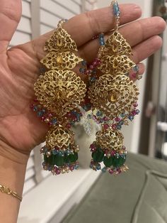 Add a touch of elegance to your ensemble with these stunning Traditional Indian / Pakistani Jewelry Jhumki Earrings. Handcrafted with precision and care, these exquisite earrings feature intricate designs that reflect the rich cultural heritage of India and pakistan. The jhumki style adds a traditional and timeless charm to any outfit, making them perfect for special occasions or everyday wear. Make a statement with these beautiful earrings that showcase the beauty and craftsmanship of Pakistani jewelry artistry. Hyderabadi Jewellery, Multi Earrings, Hyderabadi Jewelry, Jhumki Earrings, Pakistani Jewelry, India And Pakistan, Outfit Making, Traditional Indian, Intricate Designs