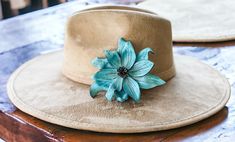 **Listing is for flower clip only, hat is not included.** These Leather Flower Hat Band Clips are a stunning accessory that effortlessly combines craftsmanship and style. Each flower is meticulously hand-cut, hand-painted, shaped, and hand-burned to ensure a one-of-a-kind, unique appearance. Crafted from real leather, these floral clips bring a touch of natural beauty to any outfit. Available in a range of captivating colors, our leather flower clips cater to diverse tastes and preferences. Whet Flower Clips, Hat Bands, Hand Burn, Flower Hat, Hat Accessories, Leather Flower, Feather Hat, Hat Ideas, Flower Bag