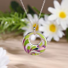 Add a pop of color to your look with the flower enamel necklace. An unusual silver necklace finished with a pendant of mixed coloured enamel circle set in a flower design. A tonal combination of colours make this a very versatile necklace to wear with lots of different outfits.Carat Weight: 0.225 ctStone Size: 1,1.2 mmNumber of Stones: 17 Stone Shape: RoundStone Color: Diamond WhiteWeight: 4.93 gWidth: 25 mmHeight: 28.8 mmThickness: 5.3 mmMaterial: 925 SilverStone Type: Jeulia® StonePlating Colo Multicolor Enamel Round Pendant Necklace, Elegant Necklace With Artistic Round Pendant, Green Necklace With Large Flower Pendant, Green Flower Pendant Necklace With Large Pendant, White Gold Enamel Round Pendant Necklace, White Gold Enamel Necklaces, Dreamy Garden, Beauty Art Drawings, Enamel Necklaces