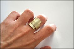 A unique, wide, folded ring, so simple and minimalist that you can wear it everyday. ❤️  This ring is made of metal sheet which is hand-cut, brushed and polished to a matte/brushed finish. ★ AVAILABLE MATERIALS :    - German silver    - Brass    - 18K Gold Plated brass    - Copper    -  Sterling silver.925  ★ MAXIMUM WIDTH :  2cm / 0.8 inches ★ S I Z E : A little adjustable, but please choose your US size so that it fits better to you.  I can make it with more or less thick metal, in order to be Wrap Around Ring, Ring Wrap, Everyday Ring, Geometric Ring, Ring Simple, Everyday Rings, Modern Ring, Minimalist Ring, Unique Ring