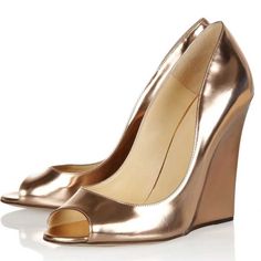 Step into elegance with our Champagne Metallic High Heels. These Peep Toe Wedge Pumps are perfect for evenings, blending style and comfort seamlessly. Elevate your look effortlessly. Color: Champagne Heel Type: Wedge heel Heel height: 4.72" / 120 mm approx Product measurements were taken using size 8. Please note that measurements may vary by size. Toe: Peep toe Padded insole for all-day comfort. Champagne color explains the personality of nobility. The wedge helps to reduce the pressure on your foot. Customization service would be provided. Handcrafted US sizing. Fits true to size. Luxury Gold Platform Heels, Gold Elegant Platform Sandals, Gold Platform Heels For Formal Occasions, Elegant Gold Platform Sandals, Glamorous High Heel Wedge Sandals For Formal Occasions, Elegant High Heel Wedge Sandals For Evening, Elegant Gold High Heel Wedge Sandals, Luxury Gold Platform Wedge Sandals, Gold Wedge Heel Sandals For Evening