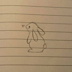 a drawing of a bunny on lined paper