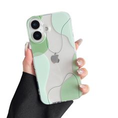 a person holding an iphone case in their hand with the back cover painted green and white