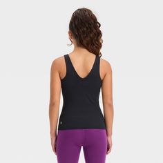 Why we're ALL IN: Solid-color athletic tank top with flat seams keeps them comfortable during any activity. Crafted from recycled polyester with spandex and a UPF 50+ rating to keep them feeling cool and fresh and shield them from the sun. Tailored in a fitted, below-hip length hip with a V-neck front and back for a sporty vibe. All in Motion™: Made for every move, priced for every day. Fitted Breathable Solid Color Tank Top, Fitted Solid Color Breathable Tank Top, Fitted Solid Breathable Tank Top, Breathable Compressive Tops For Pilates, High Stretch Seamless Sportswear Tank Top, High Stretch Seamless Tank Top For Sportswear, Compressive Breathable Tops For Pilates, Fitted Sportswear Tank Top For Light Exercise, Black Tank Activewear For Pilates