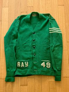 1940s Green Varsity Cardigan Dehen Knitting Co tag size S/M Measurements: shoulders 19  p2p 20 length 26 sleeve from HPS 27 Dillon normally wears a size L top and size 32 bottom. Thanks for checking out my listings, follow @QuotidianRagazine on Instagram for more! Items from the shop are in a vintage condition, and any blemishes, distressing, fading, missing buttons, or other flaws are shown as clearly as possible in photographs. The aim of this project is to give continued life to vintage styles that have been well worn and well loved. Please assess condition and reach out with any concerns before purchasing - all purchases are final sale. Vintage Green Cardigan For Fall, Vintage Sweater For Workwear, Vintage Green Long Sleeve Cardigan, Vintage Long Sleeve Sweater For Work, Vintage Green Cardigan With Button Closure, Vintage Winter Workwear Cardigan, Green Vintage Cardigan With Buttons, Vintage Long Sleeve Cardigan For Work, Green Vintage Cardigan