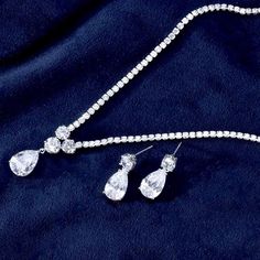 A beautiful two-piece bridal jewelry set with an incredible sparkle! Adorned with intricately faceted cubic zirconia that capture the light from every angle with a perfectly translucent appeal, the pieces are platinum plated for a flawless finish which enhances the intricate detailing and conveys a modern take on old elegance. Necklace: 41cm (approx. 16") long with a secure fold-over closure Earrings: 22mm (approx. 7/8") long and come with sturdy backs Available in Silver and Gold finishes. To c Bridal Jewelry Set, Bridal Jewelry Sets, Silver And Gold, Exquisite Design, Wedding Gown, Gold Finish, Jewelry Set, Bridal Jewelry, Wedding Jewelry