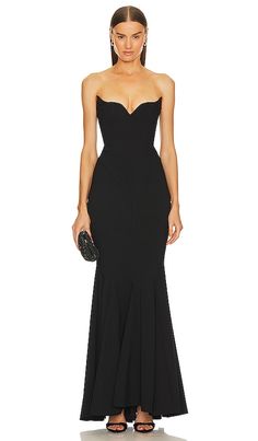 Find MICHAEL COSTELLO X Billie Gown on Editorialist. Michael Costello x REVOLVE Billie Gown in Black. - size M (also in XXS) Michael Costello x REVOLVE Billie Gown in Black. - size M (also in XXS) Elevate your style at any black-tie event with the Michael Costello x REVOLVE Black Billie Gown. With a chic bustier, flowing maxi length, and a ball gown silhouette, you'll be the epitome of elegance and sophistication.. Self: 63% rayon 33% nylon 4% spandex Lining: 97% cotton 3% spandex. Made in China Black Tie Bridesmaid Dresses, Black Tie Bridesmaids, Black Tie Wedding Guest Dress, Cutout Gown, Black Tie Party, Michael Costello, Revolve Dresses, Fall Wedding Guest Dress, Black Tie Wedding