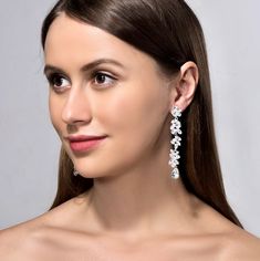 Shining brightly and quite eye-catching, this pair of earrings can complete the most sophisticated of bridal looks. Adorned with flawlessly faceted cubic zirconia that capture the light in a dazzling array of sparkles, the earrings are rhodium/rose gold/yellow gold plated for a bright finish which enhances the intricate detailing and conveys a modern take on old elegance. All it takes is a simple glance at this unique design to see its extremely classy look that makes a glamorous and feminine st Cubic Zirconia Bridal Earrings, Wedding Design, How To Look Classy, Silver Rose Gold, Bridal Looks, Bridal Earrings, Earrings Jewelry, Luxury Wedding, Wedding Designs