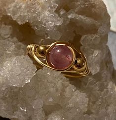 Complete your unique look with this one of a kind, handmade wire wrapped ring. Triple rose colored natural stone, gold colored beaded ring (6mm main stone). Size 8 OUR RINGS ARE... -100% handmade  -their own individual piece of art -Created in an at-home studio  -Made from individual crafting materials  -Natural stone, glass, resin and artistic silver plated wire Care instructions: -Wipe with clean dry cloth -Do not use harsh materials, tools or chemicals to clean -Fragile and delicate design, h Wire Wrapped Rose Gold Rings, Handmade Rose Quartz Jewelry In Rose Gold, Dainty Pink Wire Wrapped Jewelry, Rose Gold Rose Quartz Hand-wrapped Jewelry, Handmade Pink Toe Ring Jewelry, Hand Wrapped Rose Quartz Jewelry In Rose Gold, Handmade Pink Toe Ring, Rose Gold Hand Wrapped Ring As Gift, Hand Wrapped Rose Gold Ring Gift