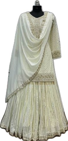 Anarkali Style Churidar With Cutdana For Wedding, Anarkali Kurta For Wedding During Navratri, Eid Straight Kurta Choli In Dola Silk, Eid Dola Silk Choli In Straight Kurta Style, Bollywood Style Choli With Mirror Work, Semi-stitched Sharara For Designer Wear Diwali, Dola Silk Choli Straight Kurta For Eid, Anarkali Churidar For Wedding Transitional Season, Anarkali Churidar For Wedding During Transitional Season