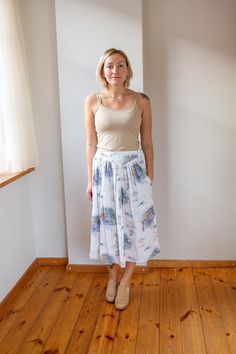 This vintage white summer skirt is light and airy, perfect for warm weather. Its A-line silhouette, reminiscent of the 80s, flatters all body types with a high waist and a stretchy waistband that comfortably fits plus sizes. Ideal for daily wear, vacations, or dates, this midi skirt is both stylish and practical. The inclusion of a single pocket adds a touch of convenience, making it a perfect blend of elegance and functionality. Measurements: Waist: 33cm | 12.9" Waist (fully stretched): 49 cm | Summer Midi Pleated Skirt, Summer Flowy Gathered Maxi Skirt, Flowy Gathered Maxi Skirt For Summer, Summer Breezy Flared Maxi Skirt, Breezy Summer Maxi Skirt, Relaxed Gathered Maxi Skirt For Summer, Breezy Gathered Skirt For Spring, Summer Gathered Maxi Skirt For Day Out, White Relaxed Pleated Skirt With Elastic Waistband