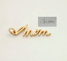 This is a listing for a 14K gold personalized custom charm.Charms are small and generally contain one word/name/signature, approximate size is 0.6-1 inch without clasp.If you need a bigger pendant, please check this listing:https://www.etsy.com/listing/489952651/sympathy-gift-memorial-signature-jewelryThere are different fixtures available how to attach your charm to the bracelet/chain:- Simple loop.Charm will be put on a simple loop that you put a chain through, it fits majority of necklaces, b Elegant Personalized Charms As A Gift For Mom, Elegant Charms For Anniversary And Mother's Day, Personalized 14k Gold Jewelry For Mom, Personalized 14k Yellow Gold Charms, 14k Gold Name Jewelry Gift For Mom, 14k Gold Name Jewelry For Mom, Elegant Engraved Charms For Mother's Day, Customizable Yellow Gold Jewelry For Mom, Personalized 14k Gold Charms