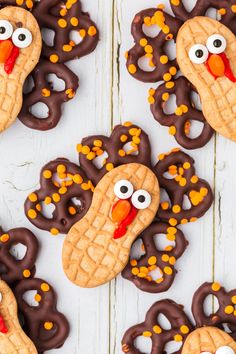 peanut butter turkey cookies with pretzels in the shape of heads and eyes on them