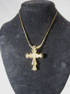 goldtone cross 2" long x1 1/2" wide chain is18" long Gold-tone Cross Jewelry With Adjustable Chain, Elegant Gold Cross Chain Necklace, Gold Cross Chain Necklace Elegant Style, Metal Cross Necklace With Adjustable Chain, Elegant Gold Chain Necklace With Cross, Gold Elegant Metal Cross Necklace, Adjustable Chain Metal Cross Necklace, Elegant Gold Metal Cross Necklace, Gold Cross Pendant Chain Jewelry