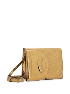 logo-embossed metallic-effect bag from DOLCE & GABBANA featuring gold-tone, calf leather, metallic finish, embossed logo to the front, concealed magnetic fastening, adjustable detachable shoulder strap and main compartment. Size Info UNI Color Detail Golden Made In Italy Material 100% Calfskin Season One Fall-Winter Season Two Fall-Winter Product bags.. Brand Dolce & Gabbana Size And Fit Width 7,87 in / 20 cm Height 6,3 in / 16 cm Depth 2,17 in / 5,5 cm Rectangular Gold Shoulder Bag With Logo Plaque, Modern Crossbody Shoulder Bag With Gold-tone Logo, Gold Crossbody Shoulder Bag With Logo Plaque, Gold Crossbody Shoulder Bag With Logo, Luxury Rectangular Shoulder Bag With Logo Plaque, Modern Gold Bag With Logo Plaque, Modern Gold Bags With Logo Plaque, Formal Crossbody Bag With Logo Plaque, Modern Shoulder Bag With Logo Plaque