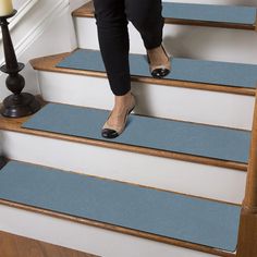 a woman walking up the stairs with her shoes on