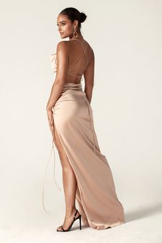 Reva' is our most elegant creation to date and the dress you've been waiting for. This satin Cowl Neckline dress is here to make your day perfect! Soft and luxurious woven satin shapes this luxe gown with a classy cowl neckline and slender rolled straps that crisscross atop the backless bodice. Sheath silhouette is sure to compliment your figure as it hugs the hips and gracefully leads into a long maxi skirt.'Reva' is fully lined for a smooth and seamless finish and has a zip to the side for eas Sleek Satin Finish Maxi Evening Dress, Chic Satin Finish Maxi Dress With Fitted Bodice, Sleek Long Satin Evening Dress, Chic Maxi Dress With Satin Finish And Fitted Bodice, Luxury Gala Dress With Corset Back, Luxury Corset Back Dress For Gala, Sleek Satin Floor-length Maxi Dress, Sleek Fitted Floor-length Satin Dress, Satin Finish Maxi Evening Dress For Gala