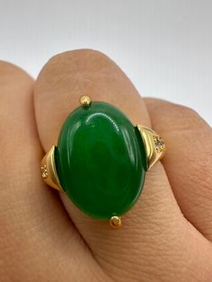 "Vintage Lucky Green Nephrite Jade ring Fun jade is color enhanced  Large green nephrite jade  Ornate German Gold finished Vintage ring, does not tarnish, NOT sterling Size 7, 7.5, 8, or 9.25  Our jeweler can re size for a $20 fee.  All rings are shipped free in the US in a nice gift box.   Check out our over a THOUSAND great reviews Engraving is $4 per letter and is not always perfect depending on the piece. It can take a few days if the jeweler is busy. This is payable to Paypal Judithsltd@gma Green Ring With Large Stone, Oval Jade Rings Hallmarked, Green Rings With Large Oval Cabochon Stone, Green Oval Cabochon Ring With Large Stone, Green Oval Rings With Natural Stones, Green Rings With Natural Stones, Green Natural Stones Ring, Fine Jewelry Green Oval Cabochon Rings, Green Jewelry With Large Round Stone