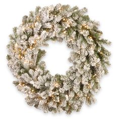 This Snowy Sheffield Spruce wreath features Feel Real® branch tip technology, creating a decoration with remarkable realism. These crush-resistant branch tips are molded from real tree branches for an authentic appearance. It is pre-strung with 70 Twinkly™ brand smart LED lights that offer a wide array of color and function choices. Lights are operated through a direct or home Wi-Fi connection. A downloadable App from Twinkly provides a broad selection of advanced and unique effects as well as l Spruce Wreath, Pre Lit Wreath, Battery Operated Led Lights, Twinkly Lights, Artificial Christmas Wreaths, Artificial Wreath, Wreaths And Garlands, Battery Operated Lights, Wreaths & Garlands