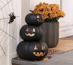 three pumpkins are stacked on top of each other