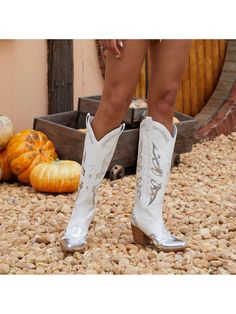 Step up your cowgirl style with these Stunning Silver Metallic Cowboy Boots! These boots feature butterfly embellishments that add a touch of femininity to the authentic cowgirl design. Made with high-quality materials, these boots are durable and stylish. Perfect for any cowgirl looking to make a statement. Color : Silver Closure Type : Slip on Insole Material : Polyester Lining Material : Polyester Outsole Material : TPR Upper Material : PU Leather Composition : 100% Polyurethane White Boots For Western-themed Fall Events, White Mid-calf Boots For Ranch In Fall, White Boots For Ranch In Fall, White Boots For Western-themed Events, White Mid-calf Boots For Fall Rodeo, White Mid-calf Boots For Spring Outdoor Activities, White Mid-calf Boots For Spring Ranch Wear, White Mid-calf Boots For Spring, White Mid-calf Boots For Rodeo In Fall