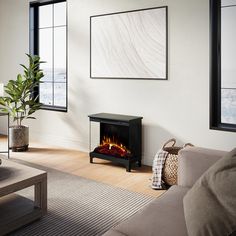 a living room with a couch and a fire place in the middle of the room