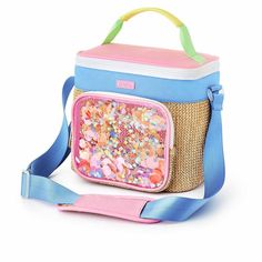 a blue and pink lunch bag with sprinkles on the inside, sitting on a white surface