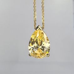 "This pendant is a pear shape yellow simulated diamond made with pure 14k yellow gold and 18\" yellow gold cable chain included item #5697 This pendant can be made with many different stone colors Message us for pricing on different color/type stones Approximate total carat weight:  2.00ctw diamond equivalent  -Center Stone Size:  10x7mm - approx 2.00ct diamond equivalent -Gem Type:  Simulated Diamond -Center Stone Shape:  Pear Shape -Center Stone Color:  Yellow -Center Stone Clarity:  VVS1 -Met Classic Yellow Gold Pear-shaped Drop Necklace, Formal Yellow Teardrop Pendant Jewelry, Gold Pear-shaped Drop Necklace With Gemstone, Classic Gold Pear-shaped Drop Necklace, Yellow Gold Pear-shaped Necklace, Gold Pear-shaped Drop Necklace For Formal Events, Gold Pear-shaped Drop Necklace For Formal Occasions, Formal Gold Pear-shaped Drop Necklace, Pear-shaped Gold Drop Necklace For Formal Occasions