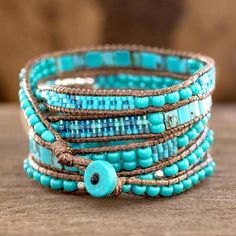 Soothing Teal Wrap Bracelet Crafted by Artisan Group - Soothing Teal | NOVICA Adjustable Blue Artisan Beaded Bracelets, Adjustable Artisan Blue Beaded Bracelets, Blue Artisan Adjustable Beaded Bracelet, Blue Spiritual Wrap Bracelet With Gemstone Beads, Spiritual Blue Gemstone Beads Wrap Bracelet, Spiritual Blue Wrap Bracelet With Gemstone Beads, Spiritual Beaded Turquoise Wrap Bracelet, Blue Bohemian Bracelets For Meditation, Blue Bohemian Beaded Bracelets For Meditation