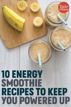 two mason jars filled with smoothies and banana slices on top of a cutting board