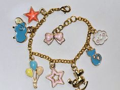 Charms are colorful and any child would love it - Gold tone chain, charms and components Cute Jewelry With Dangling Charms For Birthday, Cute Birthday Jewelry With Dangling Charms, Cute Nickel-free Charm Bracelet For Friendship, Playful Charms Jewelry For Birthday, Cute Charm Bracelet With Dangling Charms As Gift, Fun Personalized Dangle Jewelry, Playful Dangle Personalized Jewelry, Personalized Metal Bracelets In Cute Style, Gold Themed Charm Bracelet