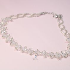 This white crystal bead choker is perfect for cocktail party outfit, wedding party, features shiny white bead with adjustable chain. Add this white rhinestone choker to your everyday fashion jewelry collection or as gift for your love one. Choker length: 13 +2 inches Materials: beads Jewelry Care: See more information about how to care for your jewelry here. Shipping Policy: Orders will be shipped within 1-3 business days. Economy shipping will take 7-14 days to arrive and standard shipping is 1 Adjustable Rhinestone Crystal Necklace For Wedding, Beaded Choker Bridal Necklace For Party, Adjustable Rhinestone Choker For Formal Occasions, White Sparkling Crystal Bridal Necklace, White Crystal Necklaces With Rhinestones For Party, White Crystal Necklace With Rhinestones For Party, Crystal Choker Necklace For Parties, Elegant Beaded Rhinestone Necklace As Gift, Crystal Choker For Party