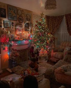 a living room filled with furniture and christmas trees