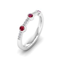 This exquisite diamond and ruby ring is a stunning piece of jewelry that exudes elegance and sophistication. The brilliant diamonds and vibrant rubies are set in a beautifully crafted, creating a luxurious and eye-catching design that is sure to make a statement. Metal: 14K Gold Setting Type: Prong Rhodium Finish: Yes, on White Gold Gemstone Details: Gemstone: Ruby Shape: Round Average Dimensions: 2.50 MM Quantity: 03 Average Cut: Very Good Average Color: Medium to Dark Red Average Clarity: Eye Dazzling Red Diamond Ring With Diamond Accents, Dazzling Red Diamond Ring With Accents, Red Diamond Ring With Accents, Red Ruby Diamond Multi-stone Ring, Red Ruby Multi-stone Ring With Diamonds, Red Ruby Ring With Single Cut Diamonds, Diamond White Ruby Ring With Diamond Accents, Formal Ruby Ring With Diamond Bezel Setting, Red Diamond Brilliant Cut Birthstone Ring