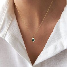 This elegant green heart necklace is crafted with 14k solid gold, embodying timeless beauty and sophistication. Its minimalist design, combined with the finest craftsmanship, makes it a perfect piece for everyday wear or a meaningful gift for a loved one. This necklace is crafted with real 14k solid gold(not plated, not vermeil, not gold filled) You don't need to worry about water, perfume or conditioner contact since real gold doesn't tarnish. The center is a heart cut green cubic zirconia bezel set delicately into the gold frame. This ensures that your piece keeps its beauty for decades to come. You can even wear this piece in water as well. Green Heart Necklace, Mesmerizing Beauty, August Birthstone Jewelry, July Birthstone Jewelry, Green Heart, Gold Colors, Zodiac Jewelry, Heart Gemstone, Jewelry Ring Box