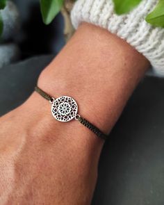 Bohemian chic Mandala Flower life bracelets for woman in silver brass and macrame. Fine and discreet it will match with all your outfits, in casual mode or for an evening it will have its effect. Unique model to offer or offer. Handmade in micro-macrame with very fine waxed thread of high quality, resistant to water and sun. Comfortable material to wear against the skin, which will not lose its color or shape over time. Dimensions: Size adjustable to all wrists thanks to the sliding knot. Strap Bohemian Silver Braided Bracelet With Sliding Knot, Silver Bohemian Braided Bracelet With Sliding Knot, Bohemian Adjustable Cord Friendship Bracelets As Gift, Bohemian Adjustable Cord Friendship Bracelets, Silver Bohemian Friendship Bracelets For Festivals, Bohemian Style Adjustable Friendship Bracelets, Bohemian Adjustable Cord Jewelry For Friendship, Resizable Silver Friendship Bracelets For Festival, Bohemian Silver Friendship Bracelets With Sliding Knot