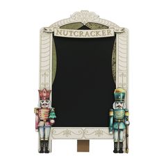 a chalkboard with nutcrackers on it next to a toy soldier figure