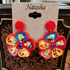 Beaded Flower Dangle Earrings By Natasha New With Tag Super Cute & Lightweight Mixed Beads Of Multiple Colors With Blue Faceted Rhinestone In Center Felt Back Post Closure 2.5” Long Dangle 2” Wide Red Beaded Flower Shaped Jewelry, Adjustable Red Flower Beaded Earrings, Red Flower Shaped Jewelry For Summer, Red Flower-shaped Jewelry For Summer, Festive Red Flower Earrings, Summer Red Flower-shaped Jewelry, Red Flower Beaded Earrings With Dangling Beads, Red Bohemian Dangle Flower Earrings, Handmade Beaded Earrings With Flower Shape For Party