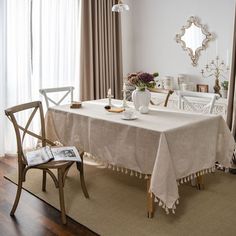 a dining room table covered with a white cloth