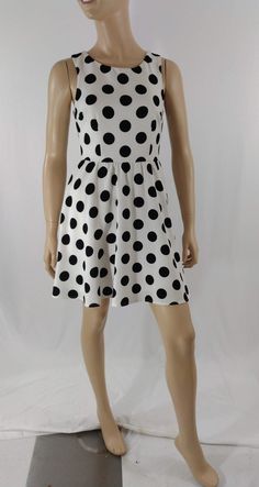 "Women's Dress Black White Polka Dot Classic Vintage by ALYA SIZE S Black and white LARGE polka dots sleeveless pull over dress with scoop neck. High quality. Excellent like new condition. Easy to wear casual chic vintage for the disco sporting life. MEASUREMENTS: Length - 32.5\" Bust (underarms to underarms) - 33-36\" Waist - 27\"unstretched Hips -22\"x2 MODEL STATS: Ht. - 5' 8.5\" Bust - 34\" Waist - 25\" Hips - 35\" *Please check measurements to ensure proper fit and remember to allow extra r Fitted Polka Dot Sleeveless Dress For Spring, Sleeveless Polka Dot Mini Dress, Casual Polka Dot Sleeveless Party Dress, Polka Dot Sleeveless Mini Dress, Casual Polka Dot Sleeveless Dress For Party, Fitted Polka Dot Sleeveless Casual Dress, Polka Dot Sleeveless Lined Dress, Fitted Casual Sleeveless Polka Dot Dress, Casual Fitted Sleeveless Polka Dot Dress