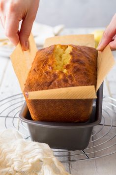 a person placing a piece of cake in a pan